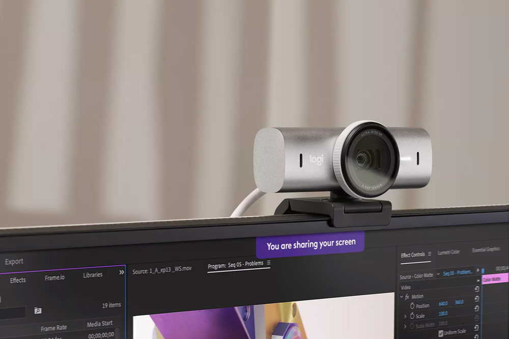  Logitech Brio 705 webcam on top of a monitor.