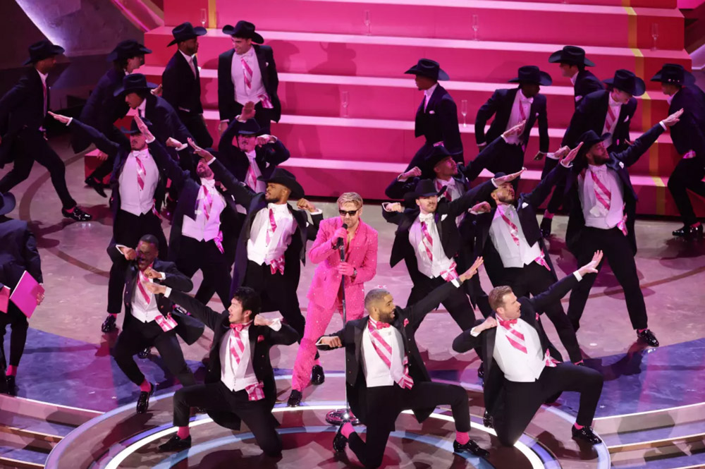 Ryan Gosling performing Barbie’s "I’m Just Ken". surrounded by cowboy Kens.