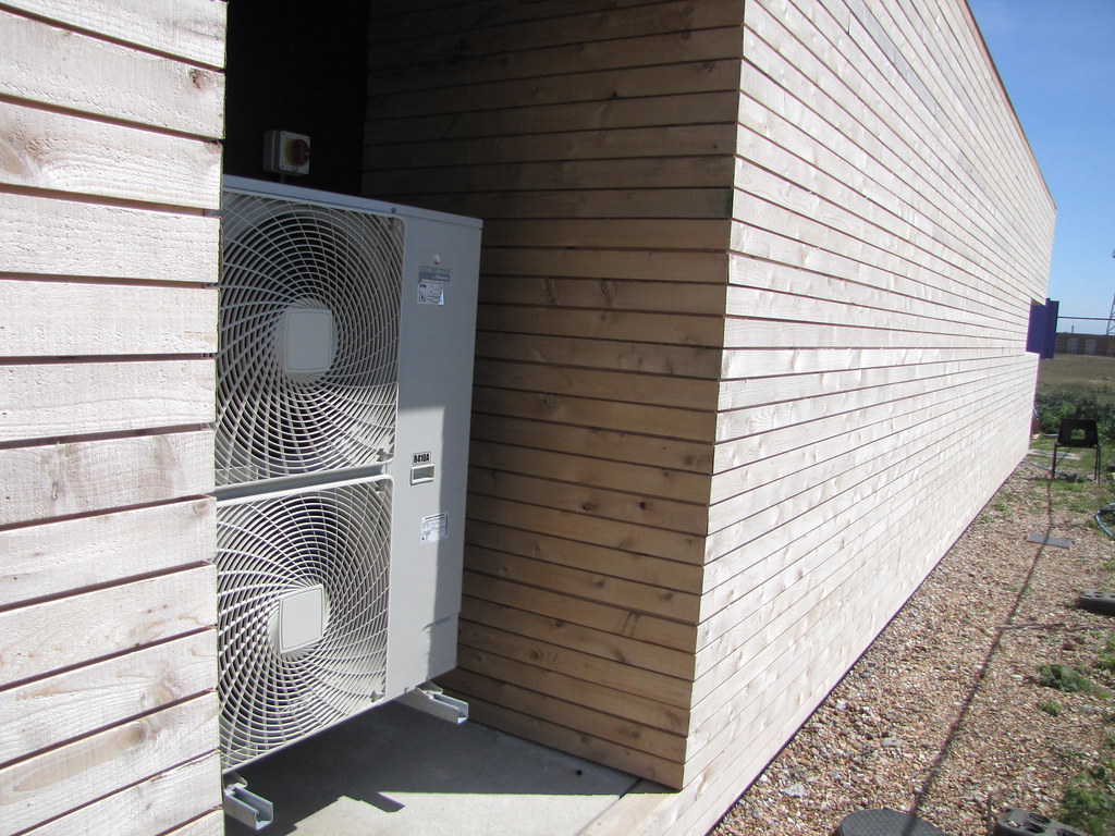 A heatpump recessed in an outside wall 