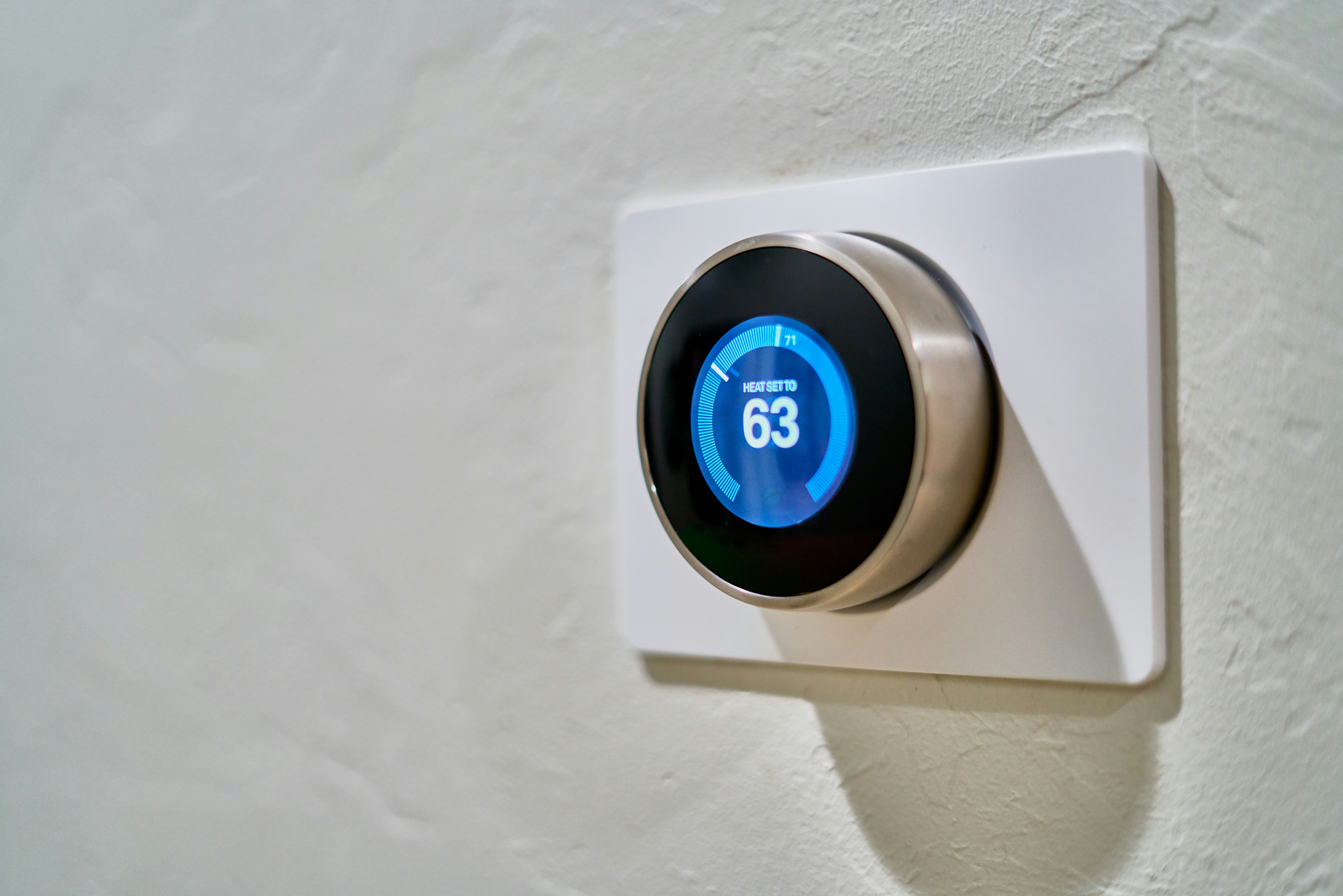 Smart Thermostat over a wall 