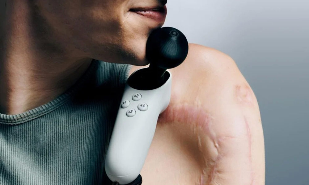 Xbox Adaptive Joystick with a person using it with their chin