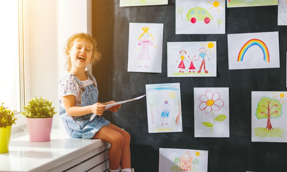 happy girl with drawings