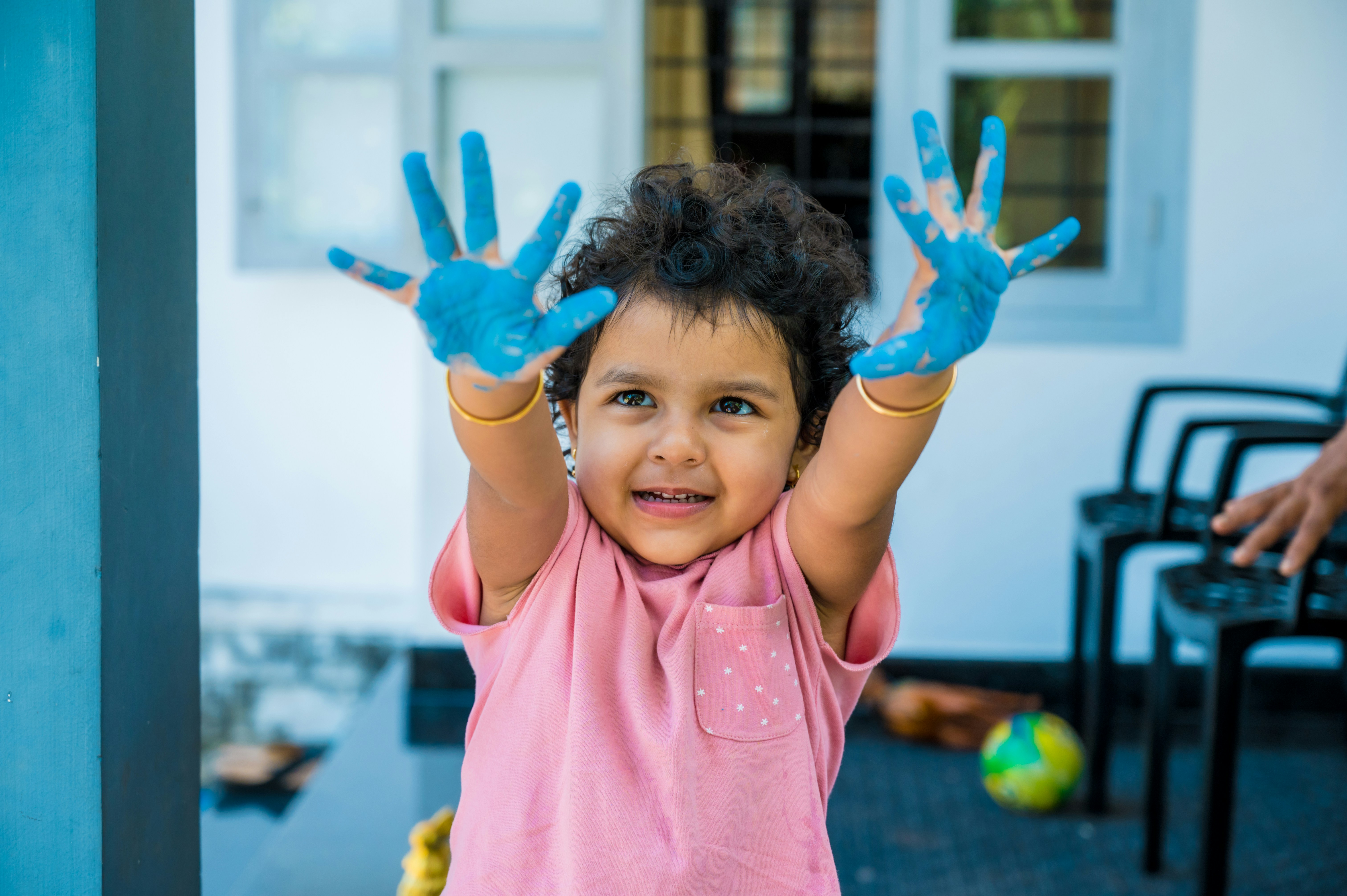 kid with paint on its hands