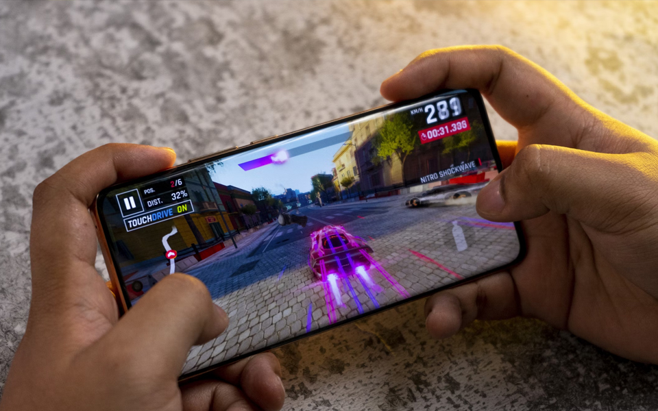 playing a racing video game on a smartphone