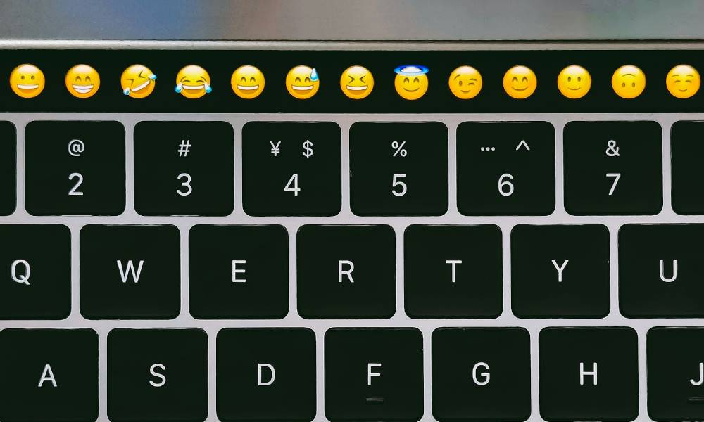 Keyboard with emojis on top