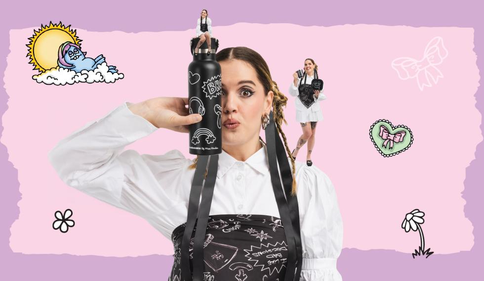 Creator Mikri Ollandeza posing with her line of products 