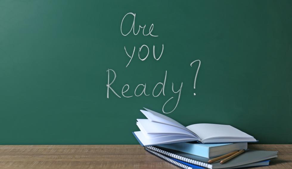 Chalkboard,With,Question,"are,You,Ready?",And,Notebooks,On,Table.