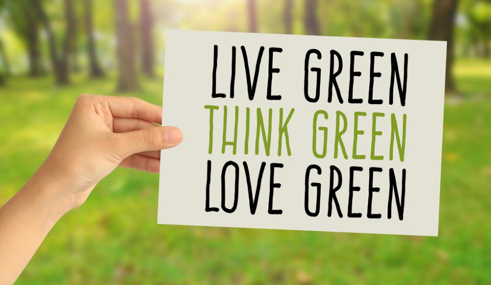 Hand,Holding,A,Paper,Card,With,Live,Green,,Think,Green,