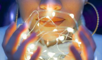 A model holding a string of led lights