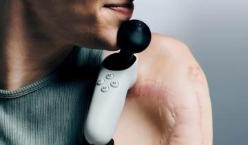 Xbox Adaptive Joystick with a person using it with their chin