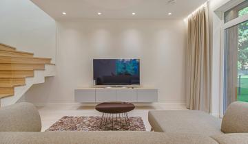 A tv in a minimal living room