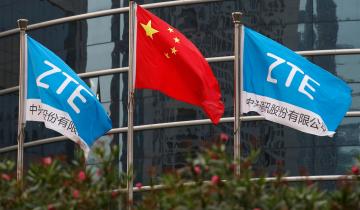 FILE PHOTO: A Chinese national flag and two flags bearing the name of ZTE fly outside the ZTE R&amp;D building in Shenzhen, China